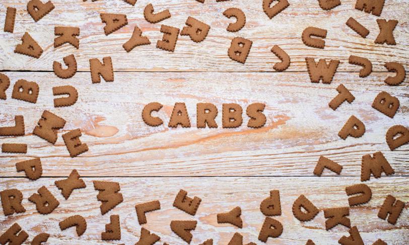 The word Carbs in wooden block letters