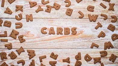The word Carbs in wooden block letters