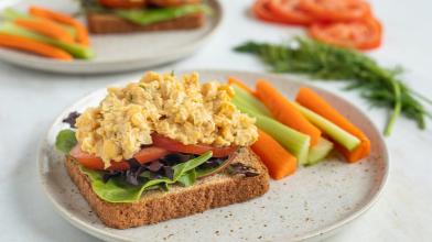 An open face vegan vegetarian sandwhich with chickpea and carrots and celery on a plate for diabetes friendly diet
