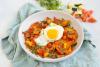 Chilaquiles with Sunny-Side-Up Eggs in a bowl with napkin for a diabetes friendly recipe