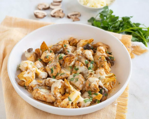Cauliflower mushroom chicken skillet in bowl.