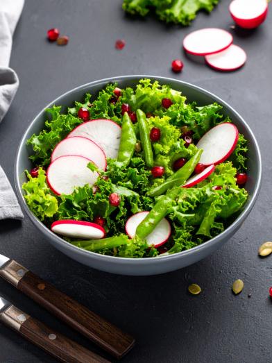 Harvest salad in bowl with radishes