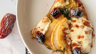 A slice of flatbread pizza with dates and pears for diabetic diet