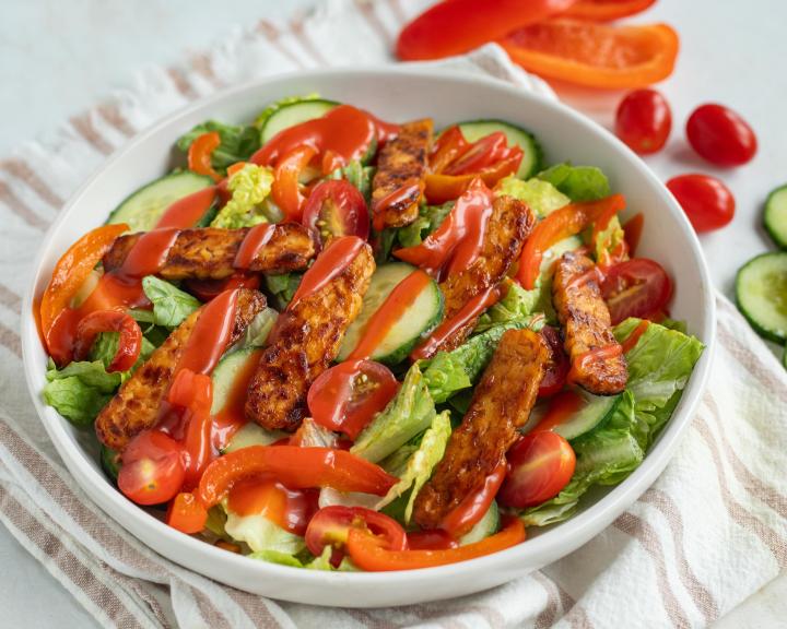 seared barbecue tempeh salad in white bowl