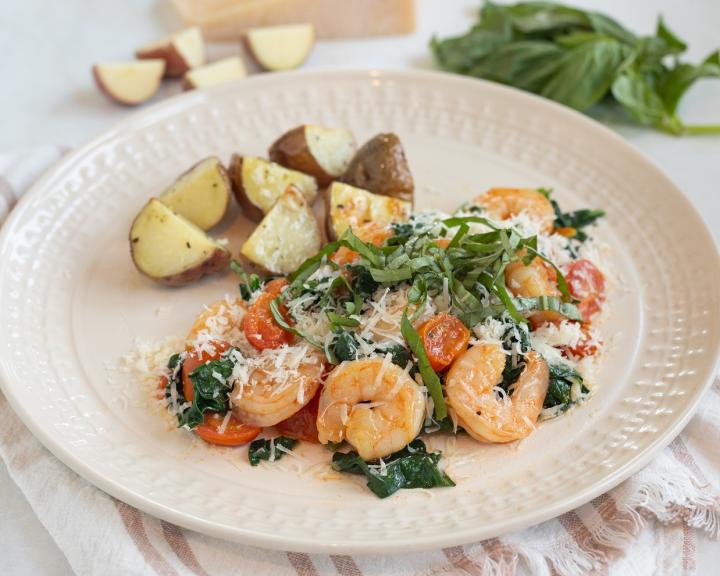 A plate of shrimp saute and diced potatoes for a DASH diet recipe for diabetes friendly eating