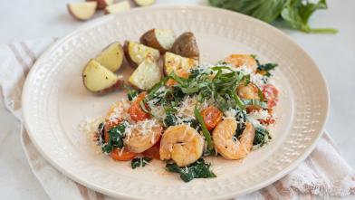 A plate of shrimp saute and diced potatoes for a DASH diet recipe for diabetes friendly eating