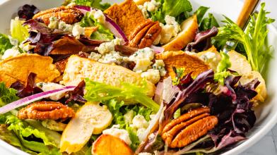 A colorful bowl of salad with homemade cider vinaigrette for a fall diabetes recipe