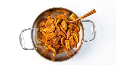 A pan filled with vegan cinnamon fried apples that are sweet but still diabetes friendly