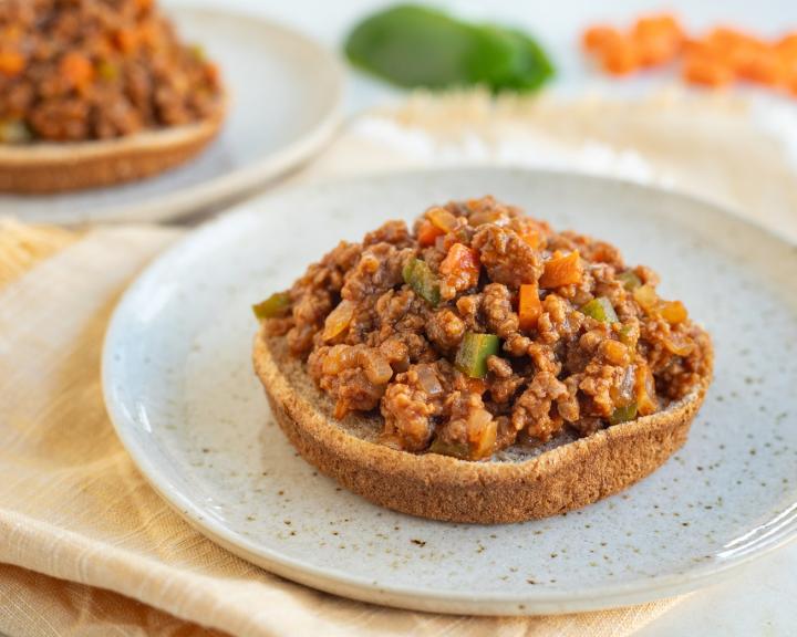A plate with an open faced vegan vegetarian sloppy joes for a diet