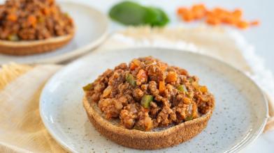 A plate with an open faced vegan vegetarian sloppy joes for a diet