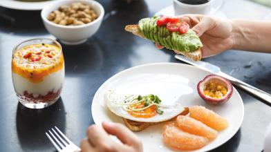 Healthy breakfast with avocado toast and fruit