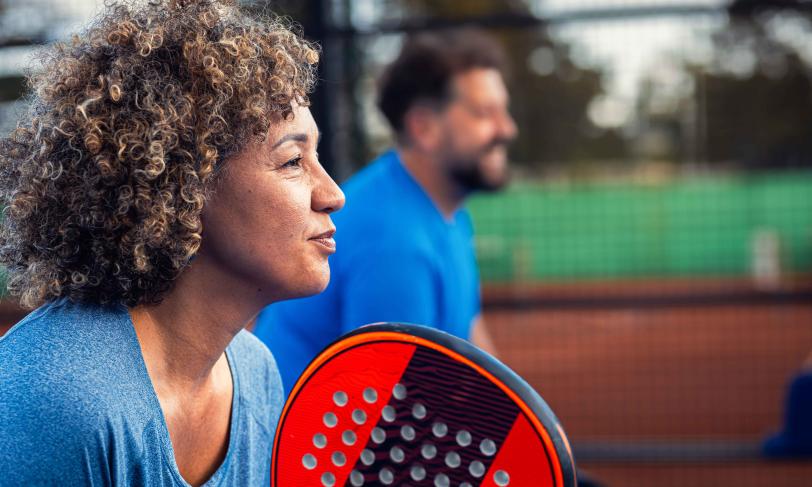 Man and woman playing pickleball