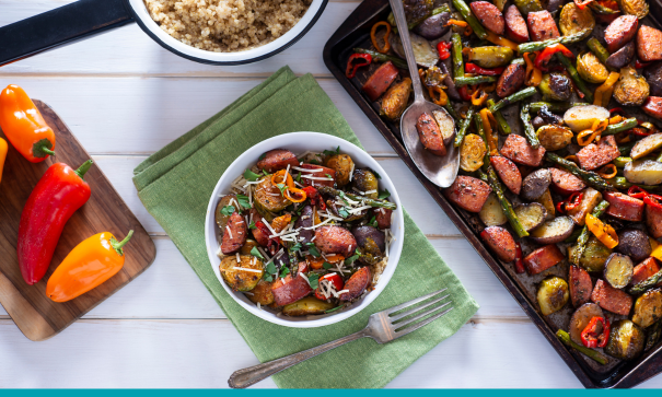 A sheet pan and bowl of a veggie-rich meal for a diabetic friendly diet