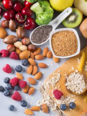 Scattered foods high in fiber like nuts, beans, and berries