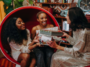 A group of women exchanging diabetes-friendly holiday gifts for food lovers